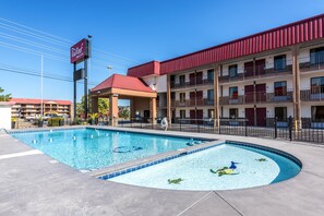 Seasonal outdoor pool, open 10:00 AM to 9:00 PM, pool umbrellas