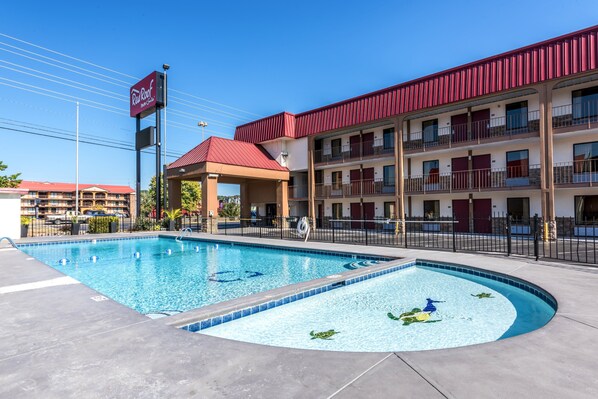 Seasonal outdoor pool, open 10:00 AM to 9:00 PM, pool umbrellas