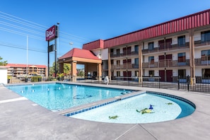 Seasonal outdoor pool, open 10:00 AM to 9:00 PM, pool umbrellas