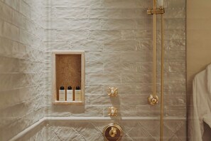 Combined shower/bathtub, free toiletries, hair dryer, bathrobes