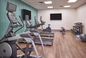 A gym with treadmills, elliptical machines, and weight equipment. - Holiday Inn Express Boca Raton-West by IHG (Boca Raton)