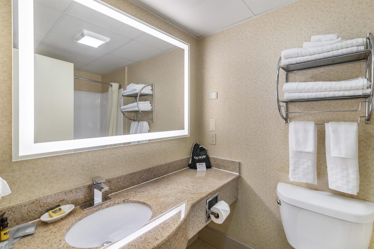 standard room, 2 queen beds, non smoking, refrigerator & microwave | bathroom | combined shower/bathtub, free toiletries, hair dryer, towels