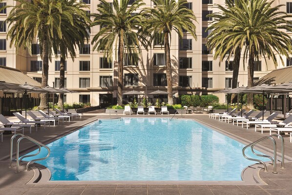 Outdoor pool, open 8:00 AM to 7:00 PM, pool umbrellas, pool loungers