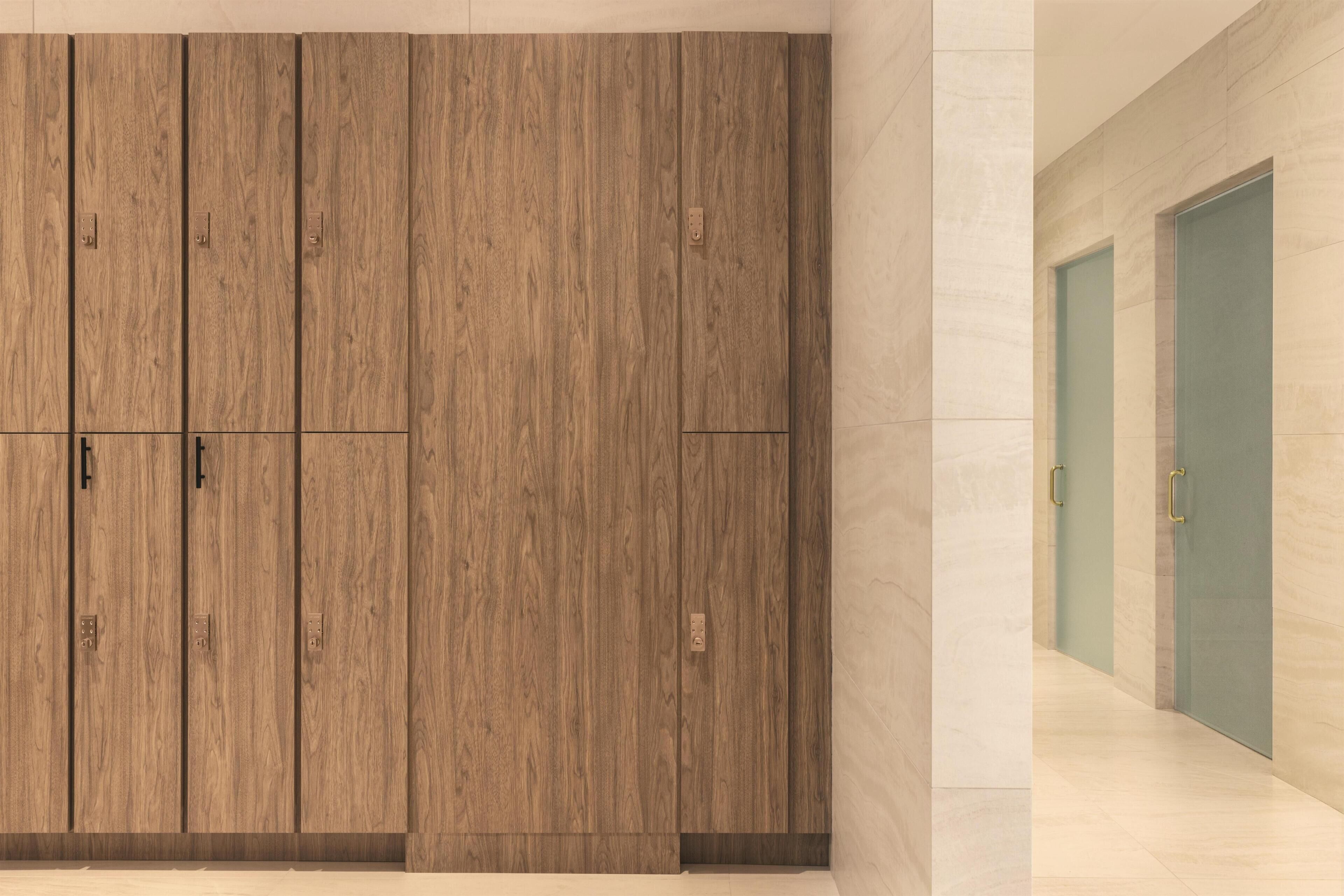 A hallway with wooden paneling and a marble floor.