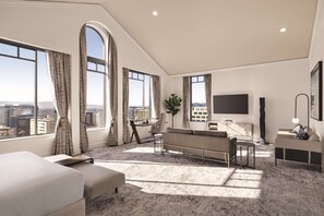 Suite, 1 très grand lit (Penthouse) | Coin séjour | Télévision à écran plat de 58 pouces avec chaînes par câble, télévision