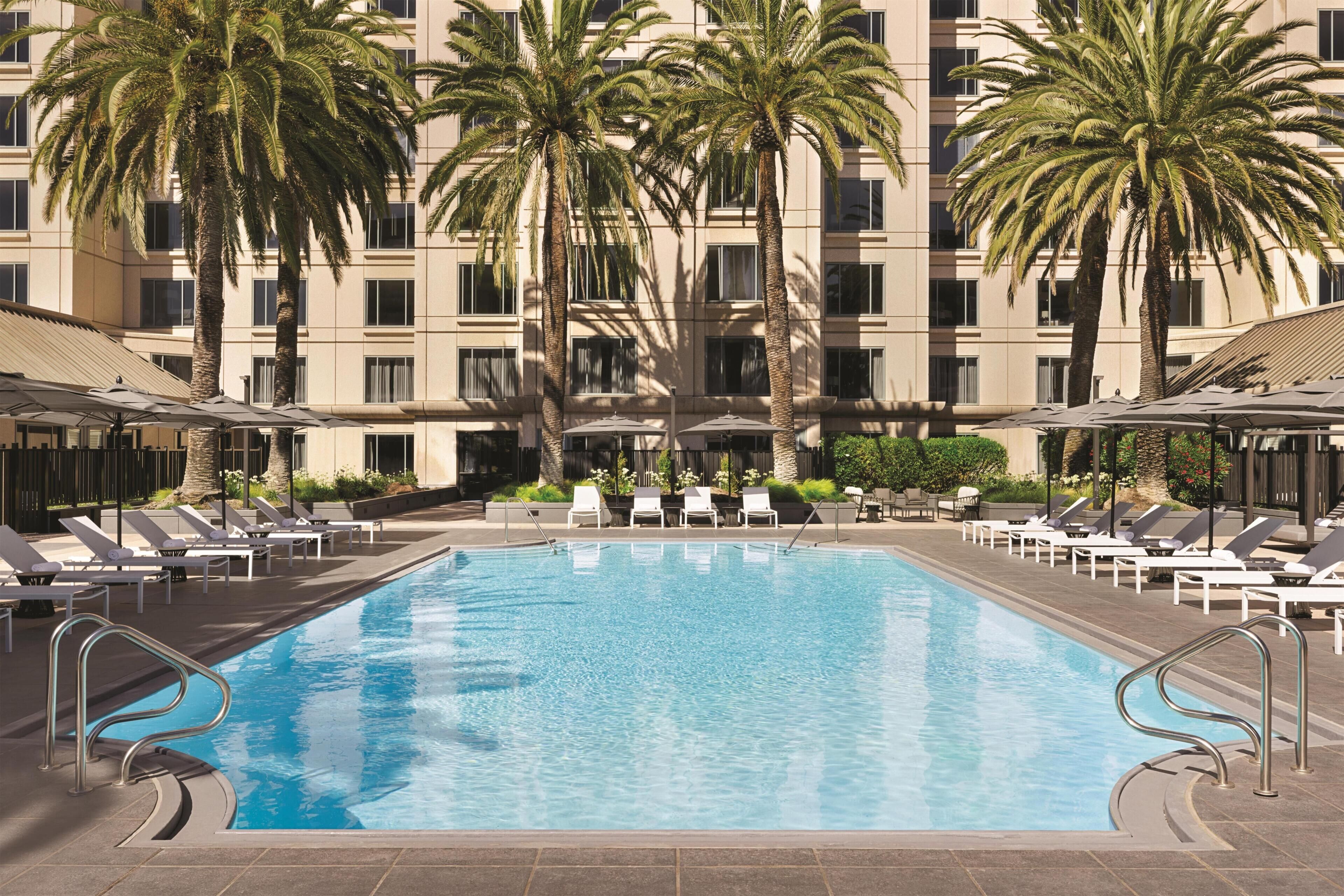 Outdoor pool, open 8:00 AM to 7:00 PM, pool umbrellas, sun loungers