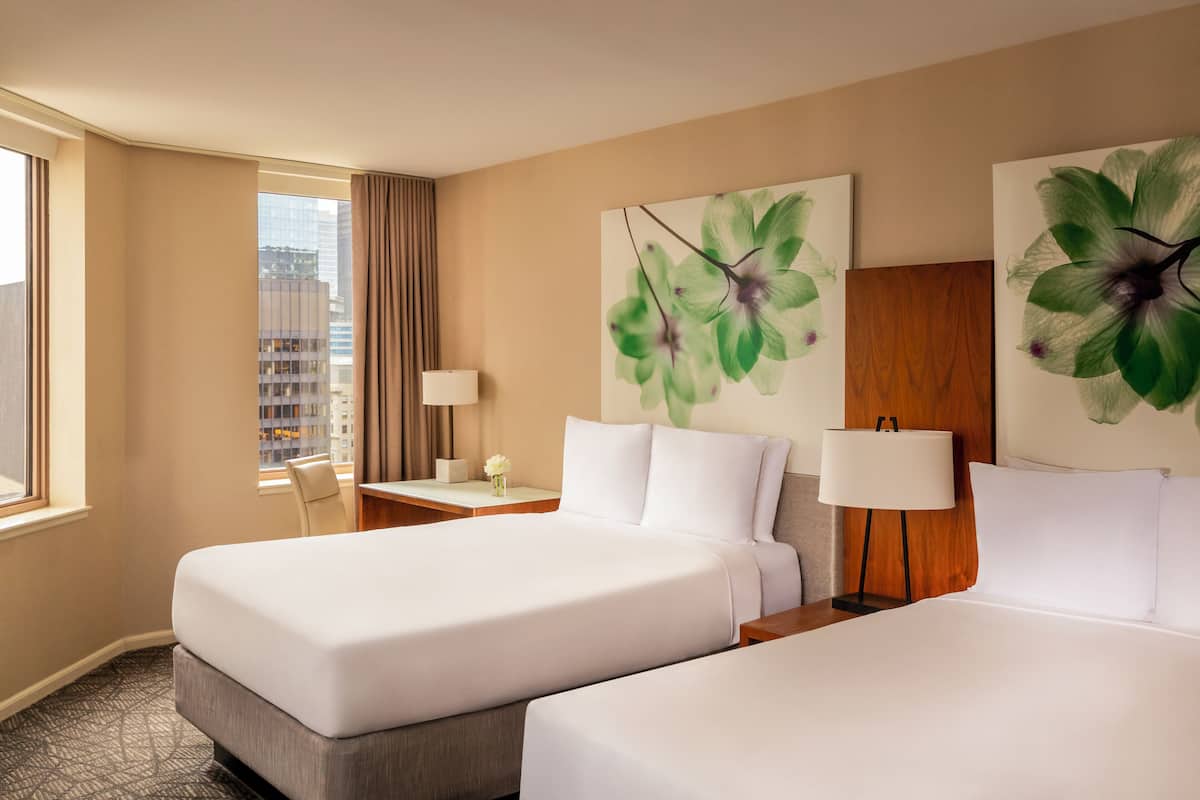 Luxe beddengoed, donzen dekbedden, pillowtop-bedden, een minibar