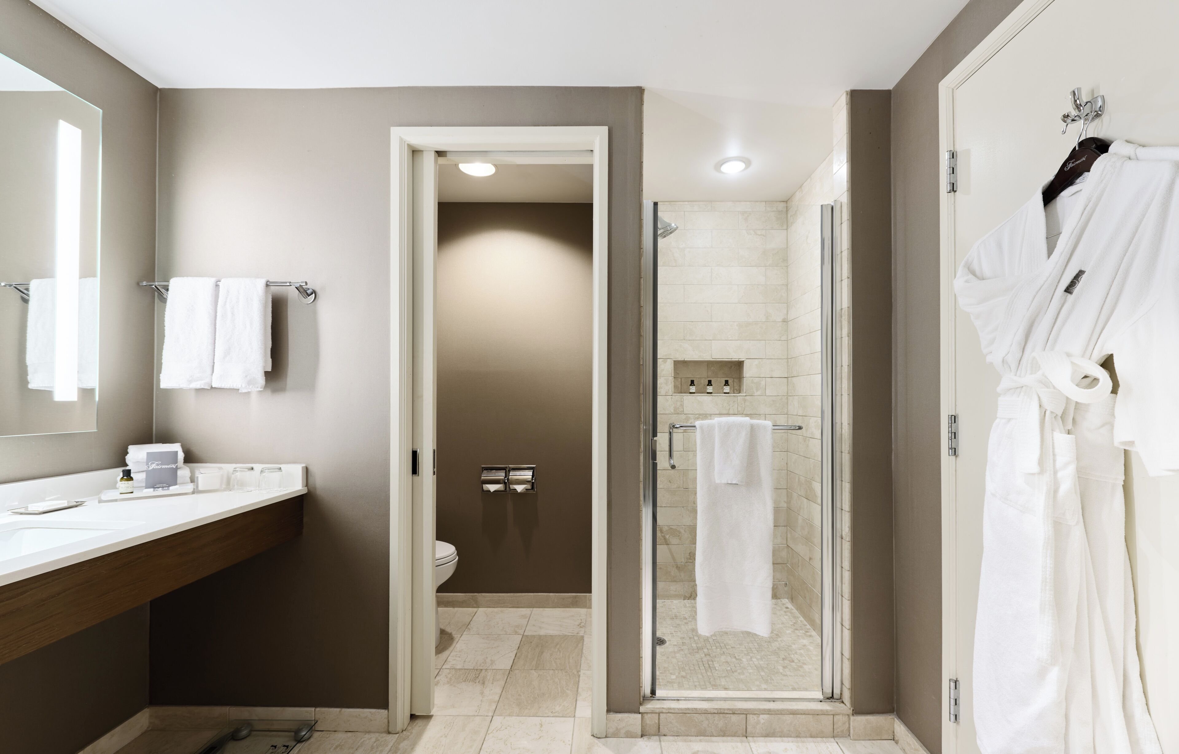 separate bathtub and shower, rainfall showerhead, designer toiletries