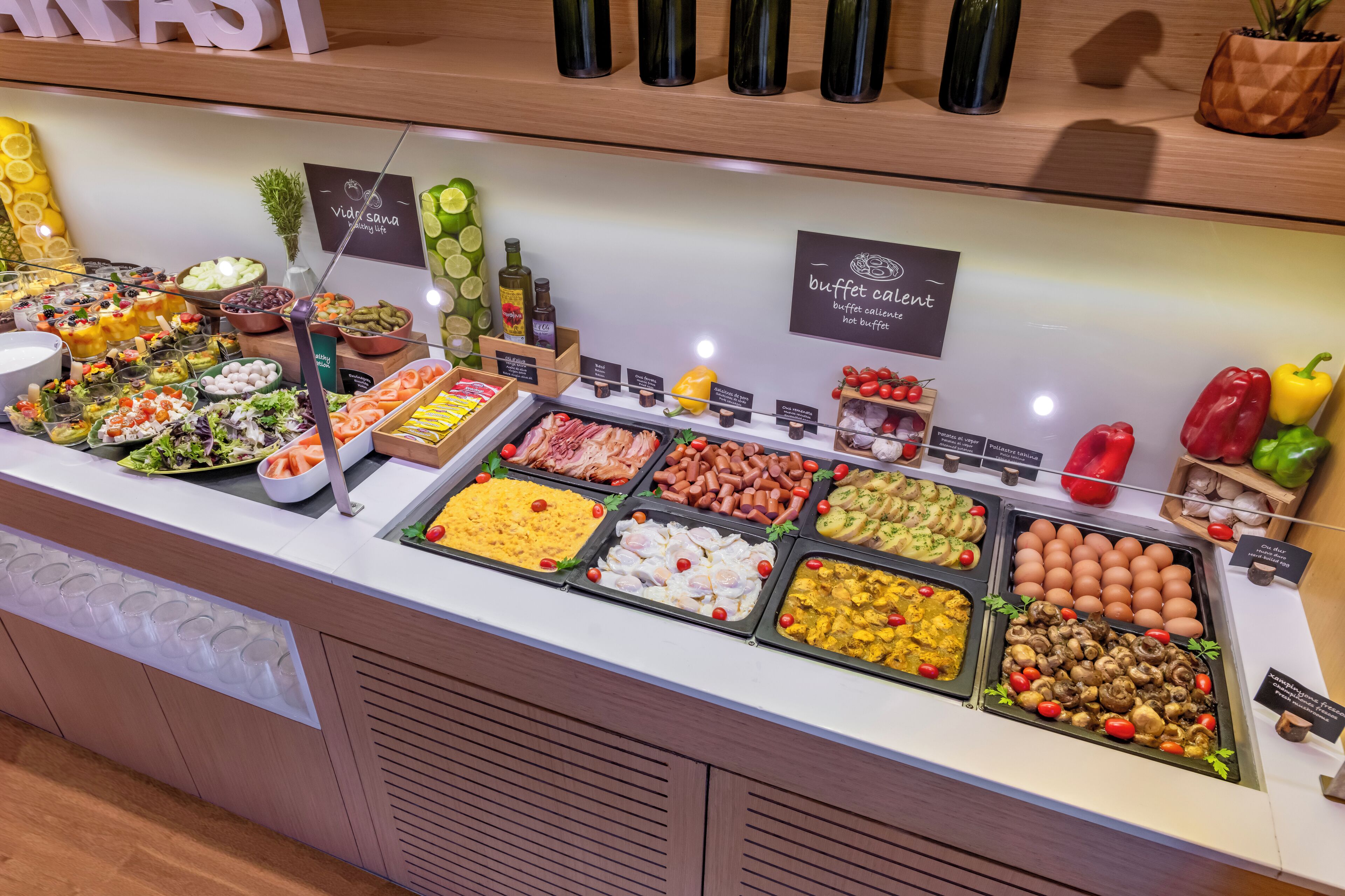 A buffet counter with various food items and a sign indicating 'buffet catering'.