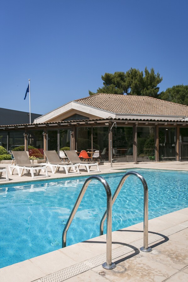 Outdoor pool, pool umbrellas, pool loungers