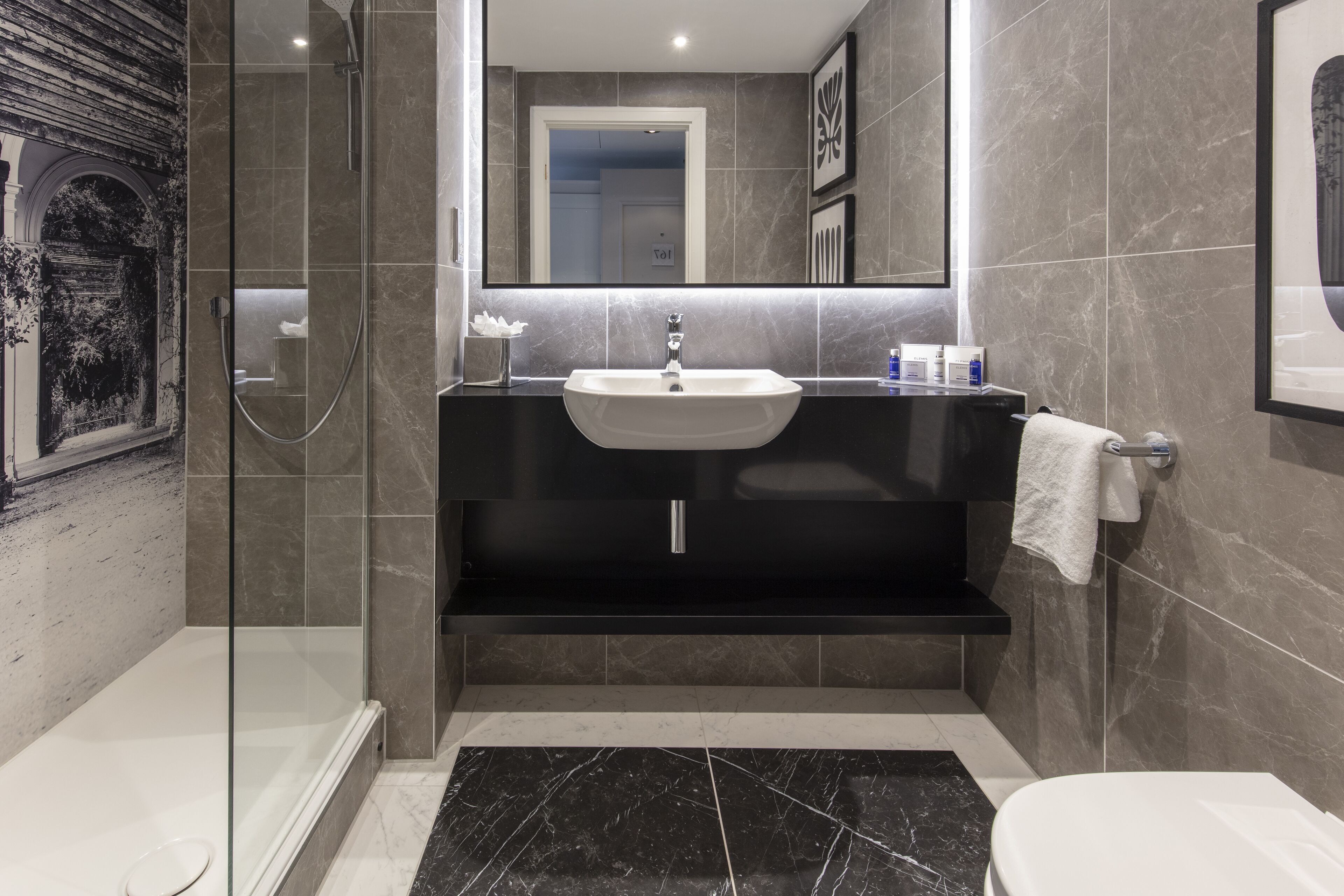 combined shower/bathtub, hair dryer, towels, soap