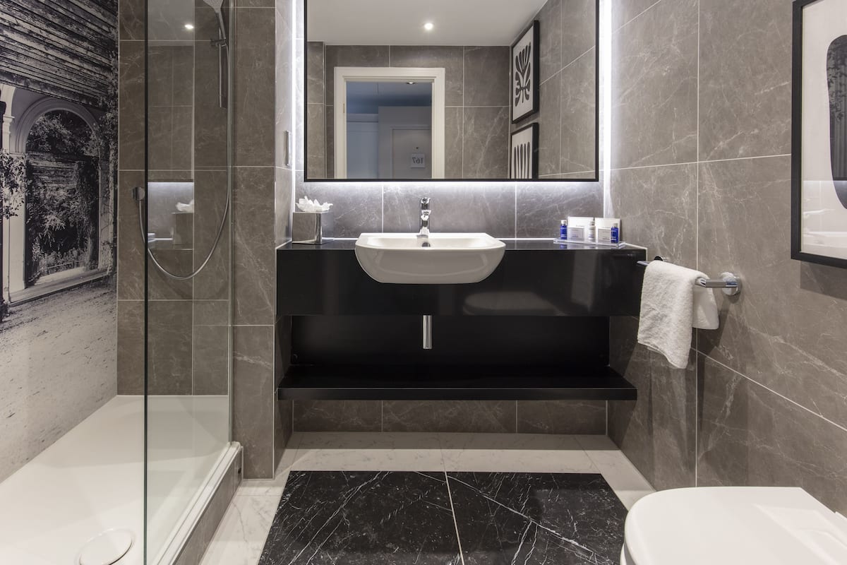 combined shower/bathtub, hair dryer, towels, soap