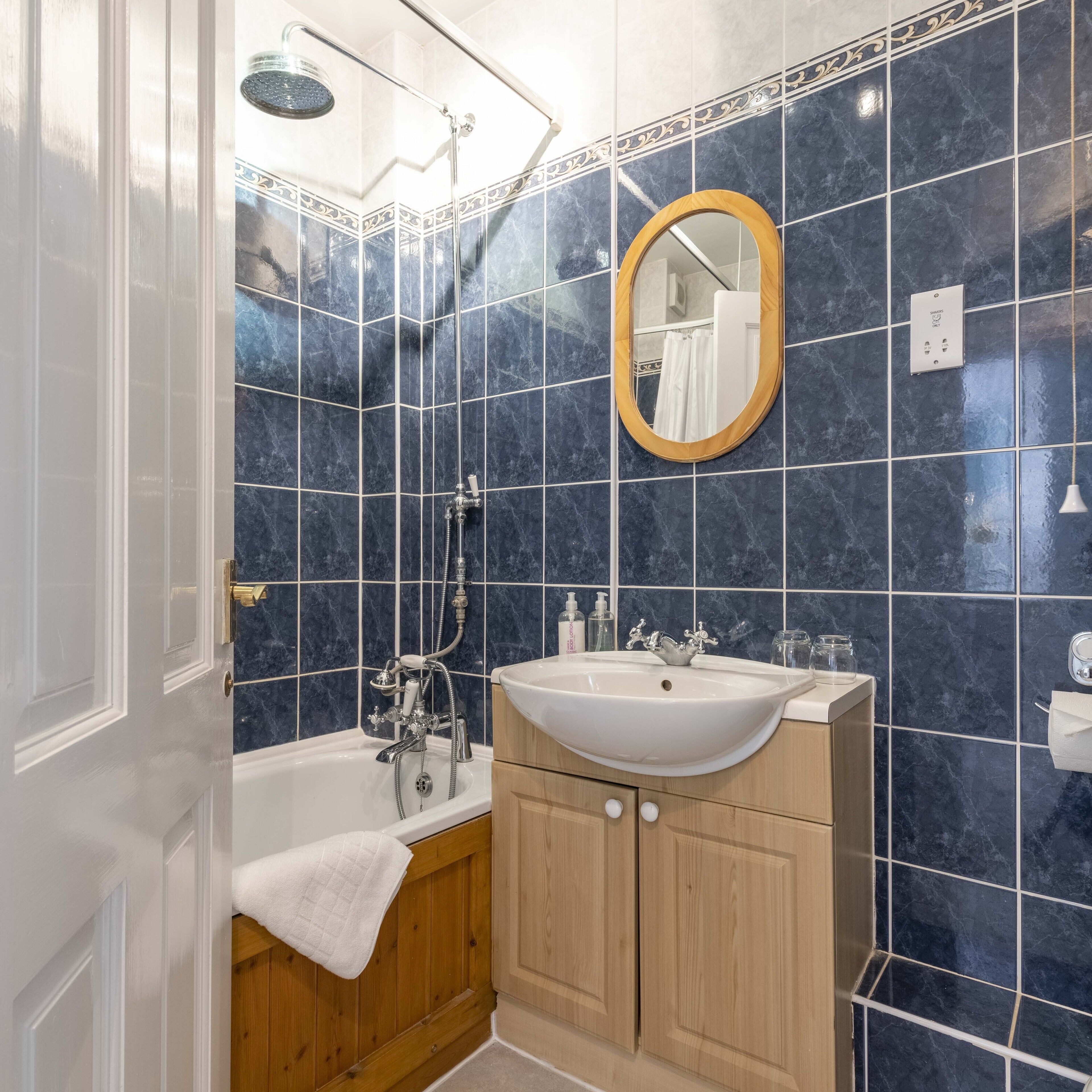 double room | bathroom | rainfall showerhead, free toiletries, hair dryer, towels