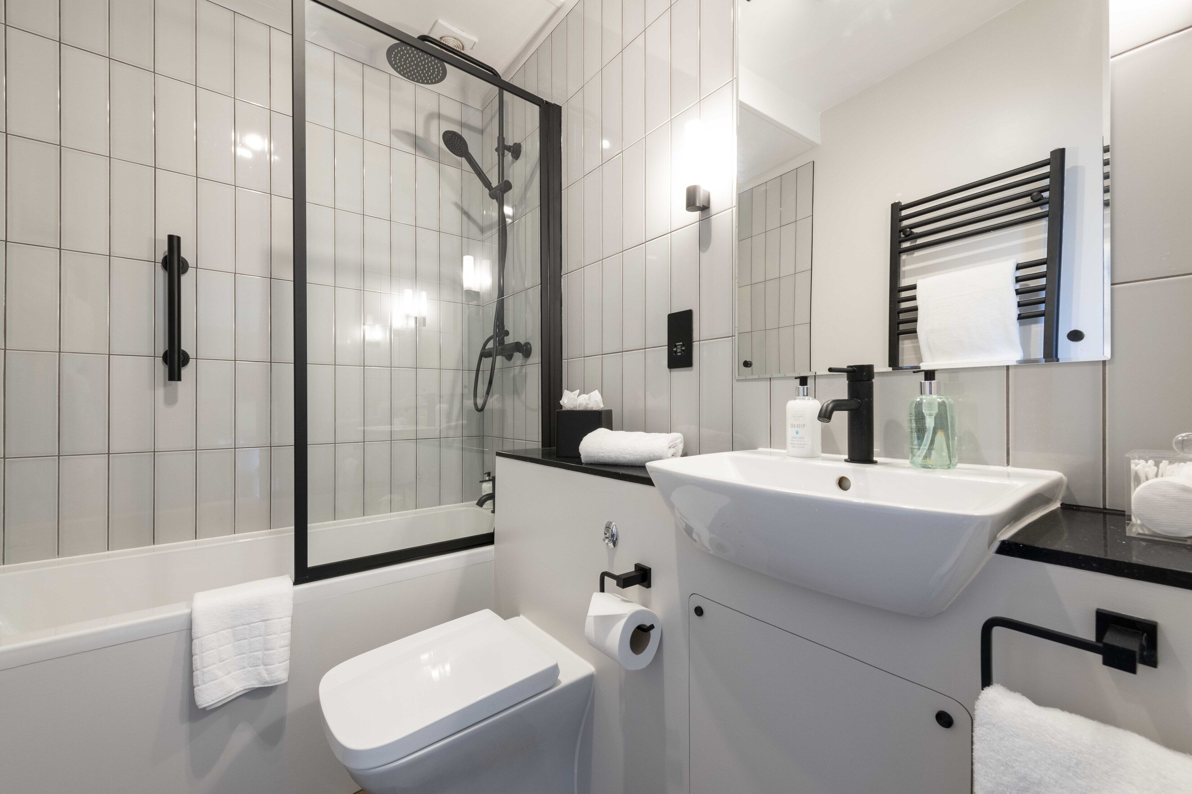studio suite | bathroom | rainfall showerhead, free toiletries, hair dryer, towels