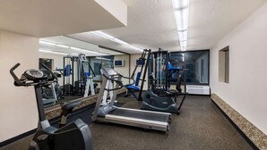 A gym with treadmills, elliptical machines, and weight equipment. - Travelodge by Wyndham Memphis Airport/Graceland (Memphis)