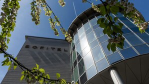 A modern building with the name 'SOFITEL' on its facade.