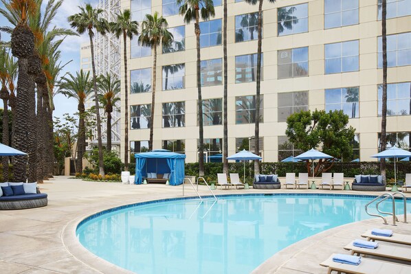 2 outdoor pools, open 6:00 AM to 10:00 PM, pool umbrellas, pool loungers