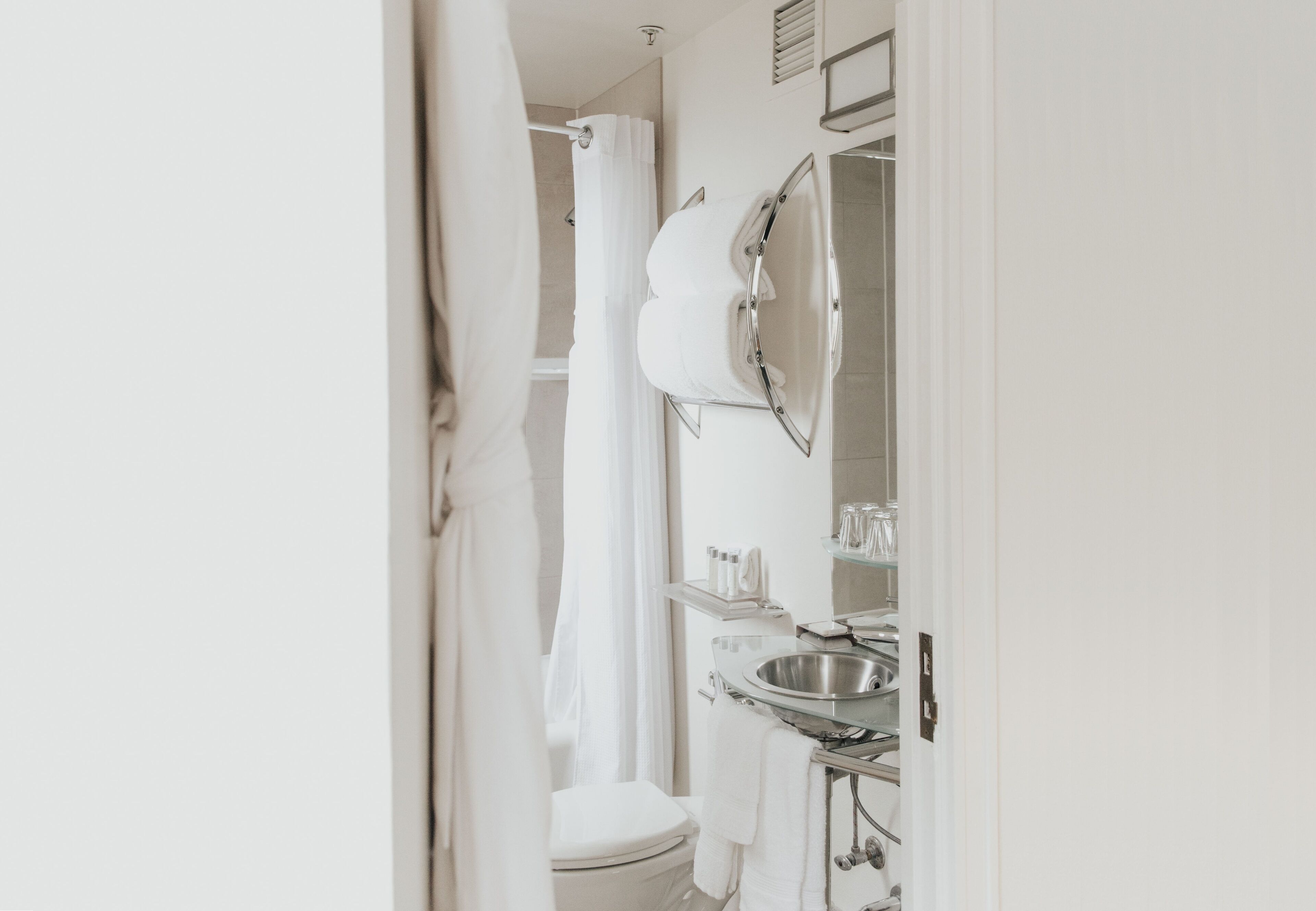 combined shower/bathtub, designer toiletries, hair dryer, bathrobes