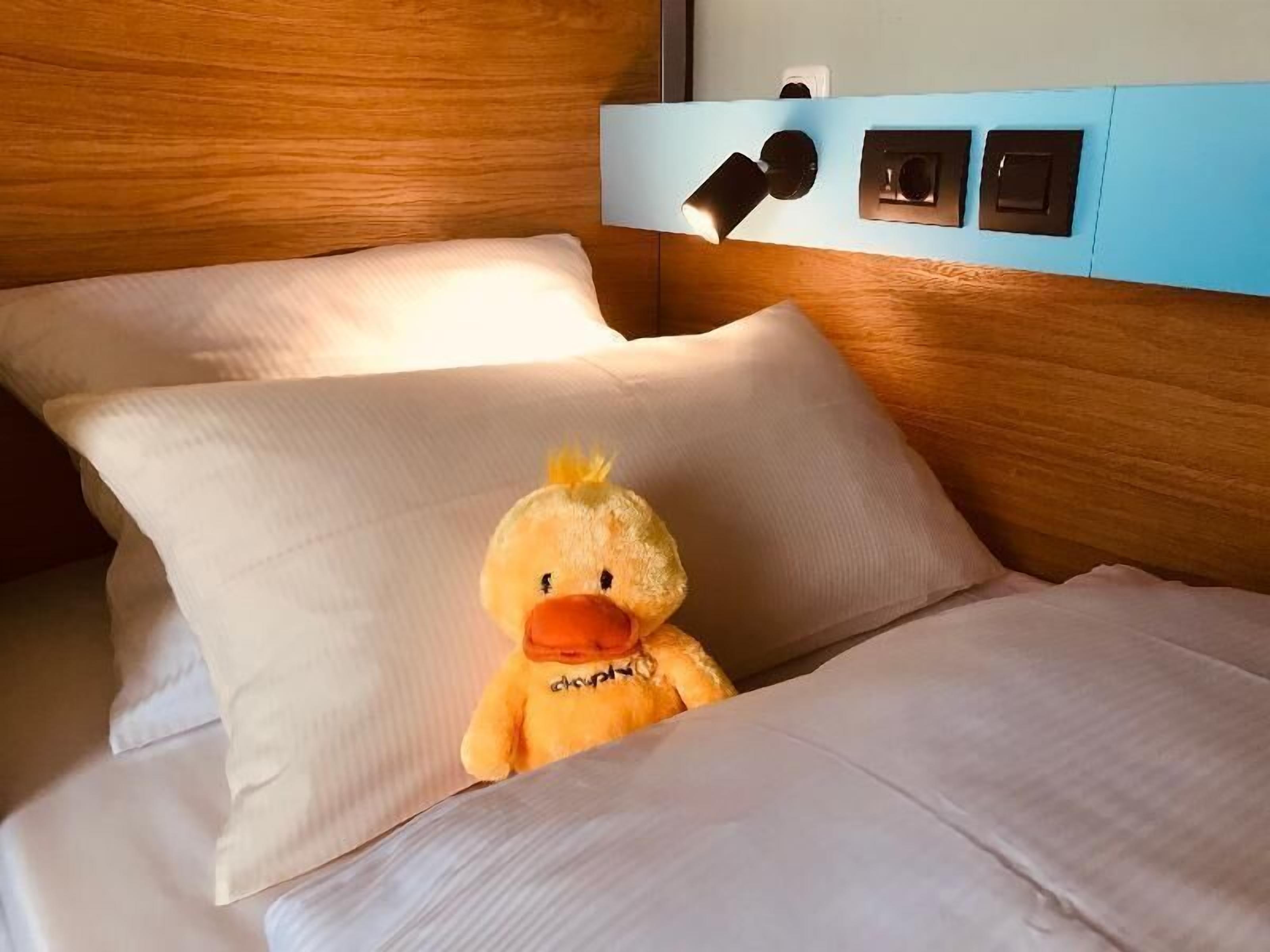 Premium bedding, desk, blackout drapes, soundproofing