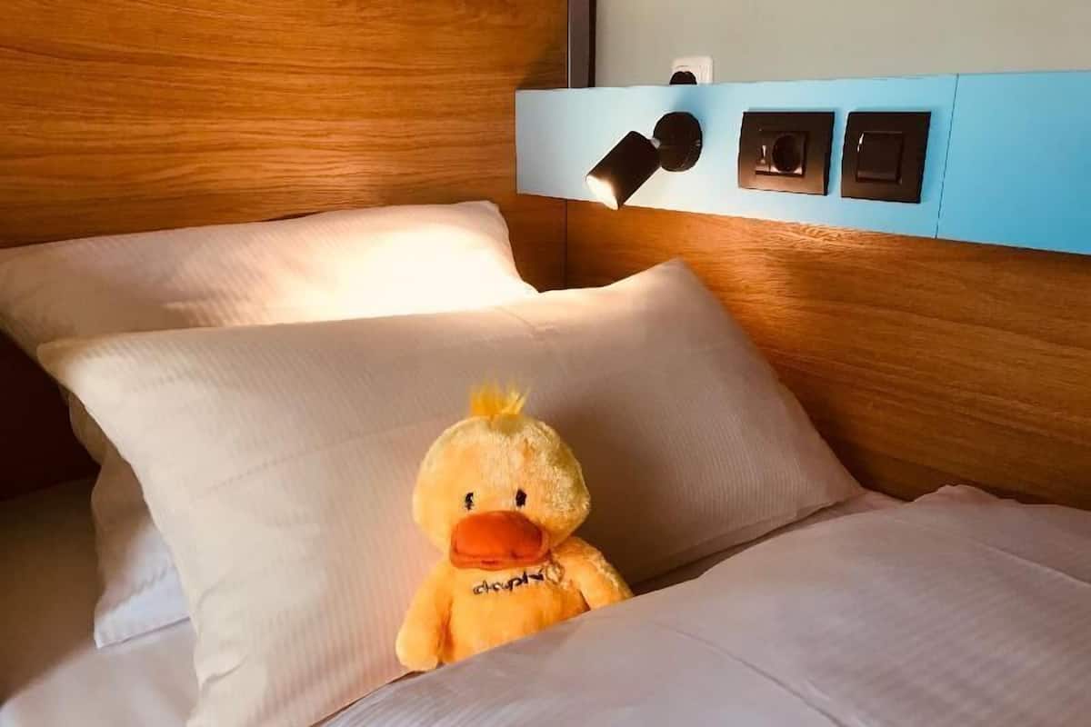 Premium bedding, desk, blackout drapes, soundproofing