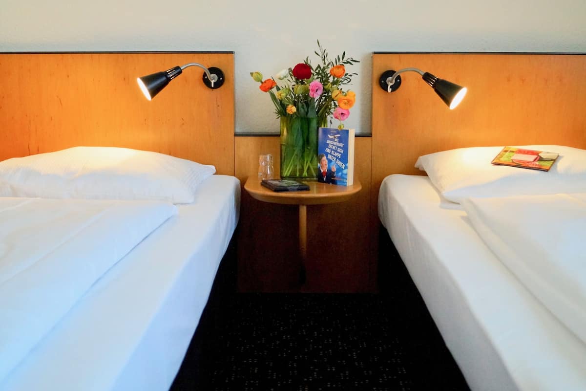 Premium bedding, desk, blackout drapes, soundproofing