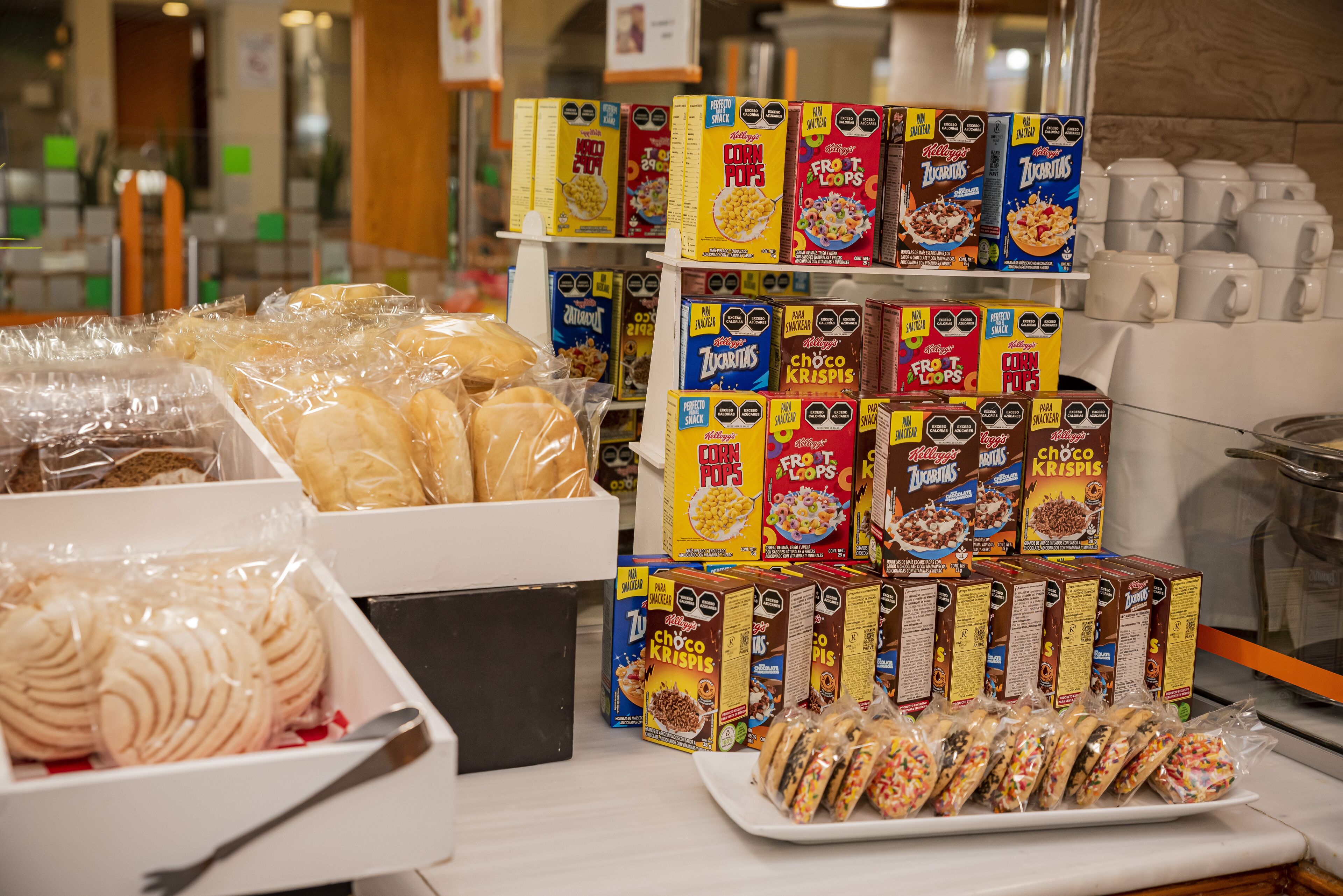 A display of cereal boxes and packaged pastries in a store.