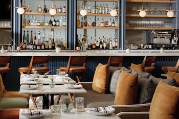 Breakfast, dinner, brunch served; alfresco dining at Kimpton Surfcomber Hotel by IHG