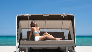 On the beach, sun loungers, beach yoga