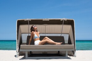 On the beach, sun loungers, beach yoga