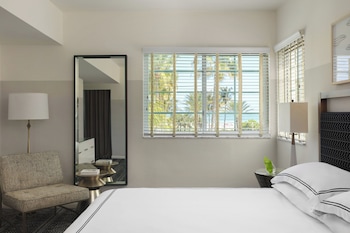 Frette Italian sheets, premium bedding, minibar, in-room safe at Kimpton Surfcomber Hotel by IHG