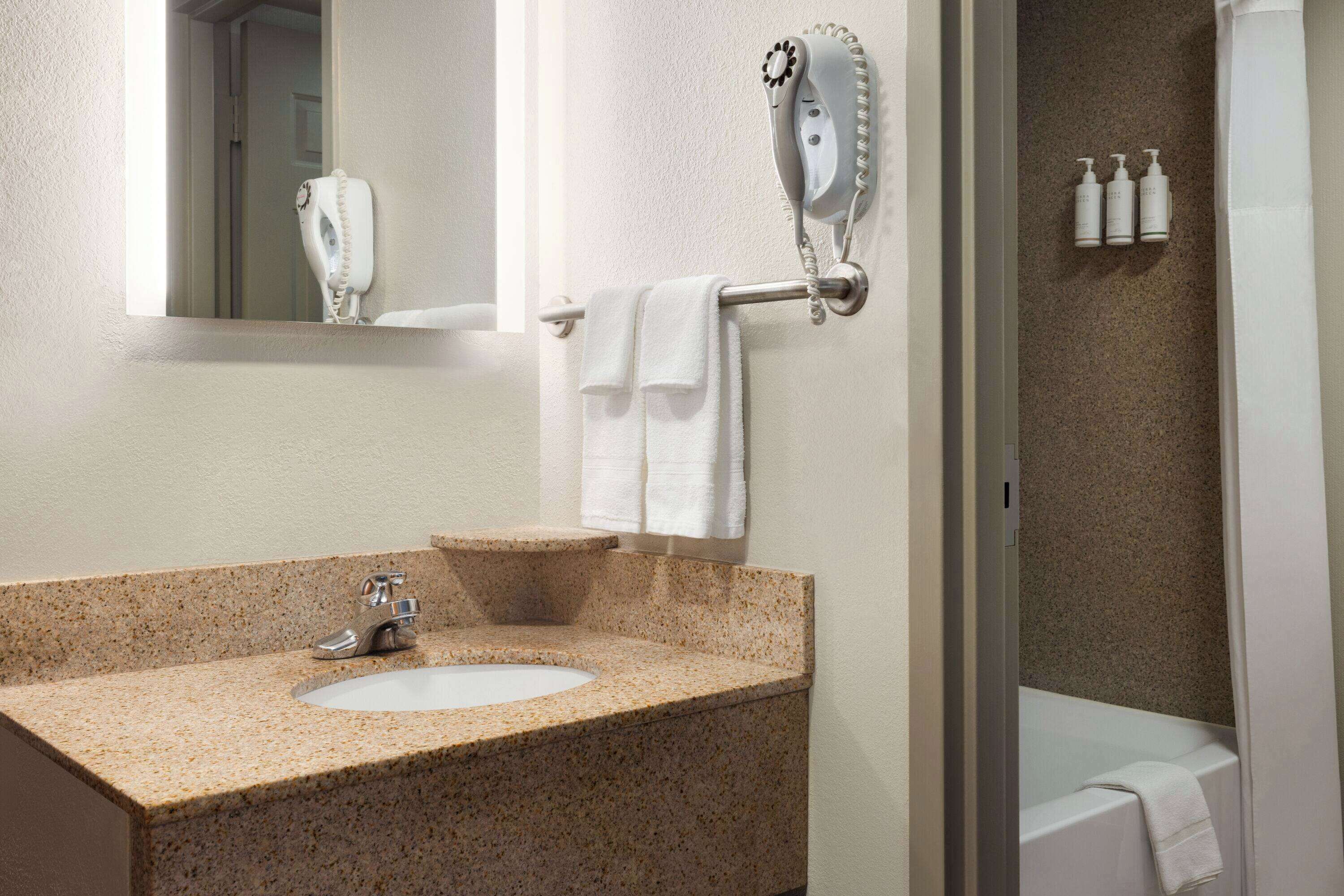 combined shower/bathtub, eco-friendly toiletries, hair dryer, towels