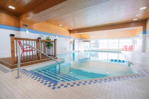 Indoor pool, open 10:00 AM to 10:00 PM, pool loungers