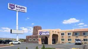 A Knights Inn & Suites building with a clear blue sky. - Knights Inn Gallup at 3208 W Hwy 66 (Gallup)