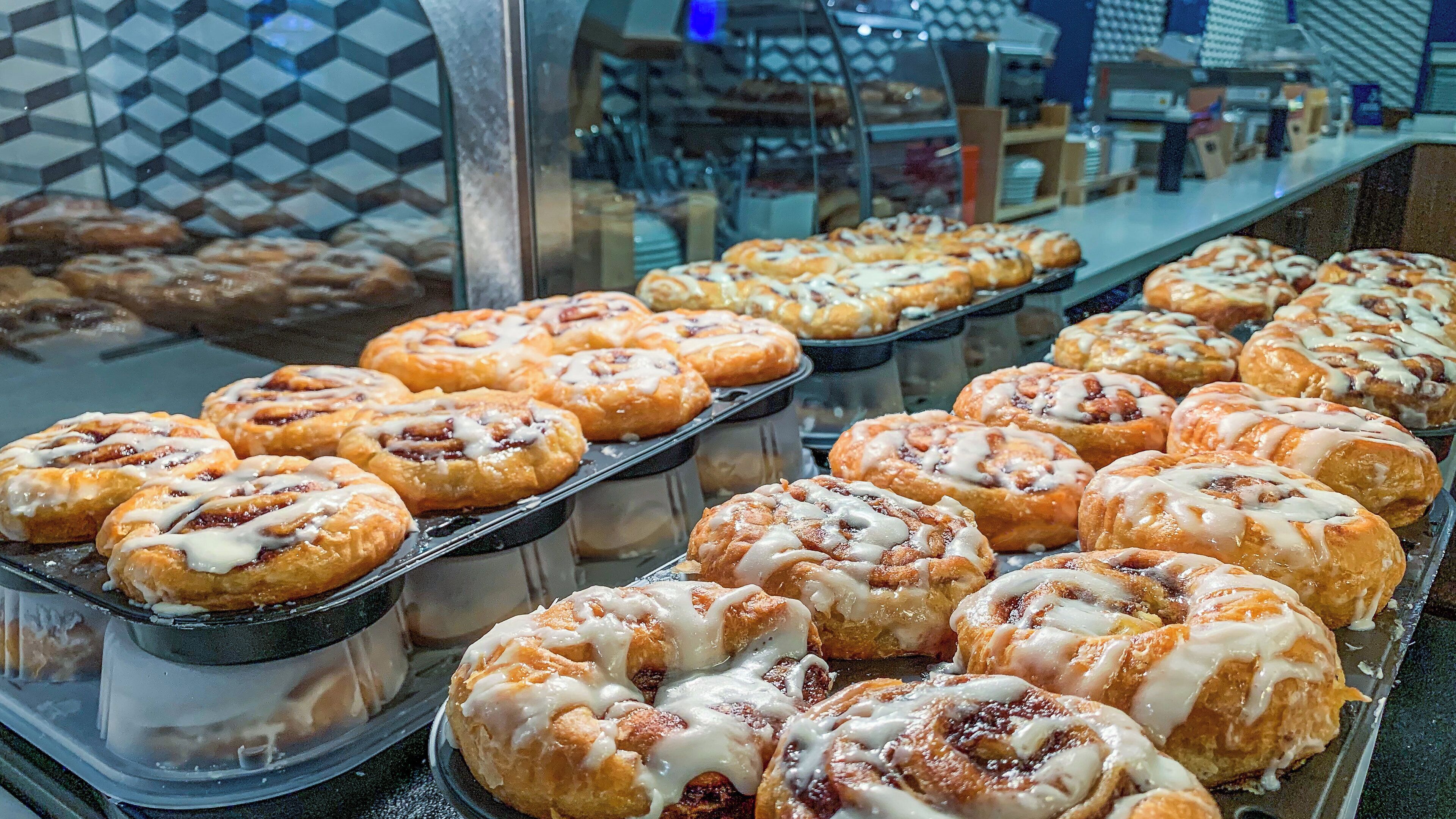 A display of pastries in a bakery setting.