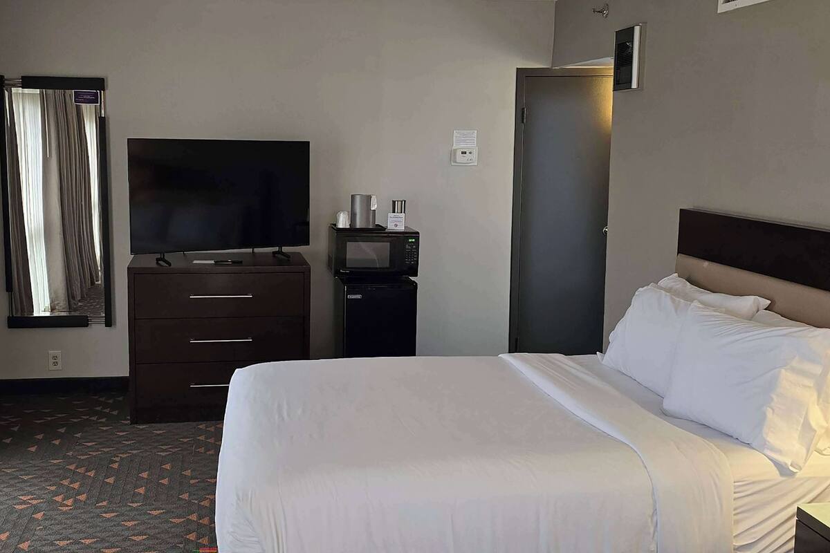 Premium bedding, desk, blackout drapes, iron/ironing board