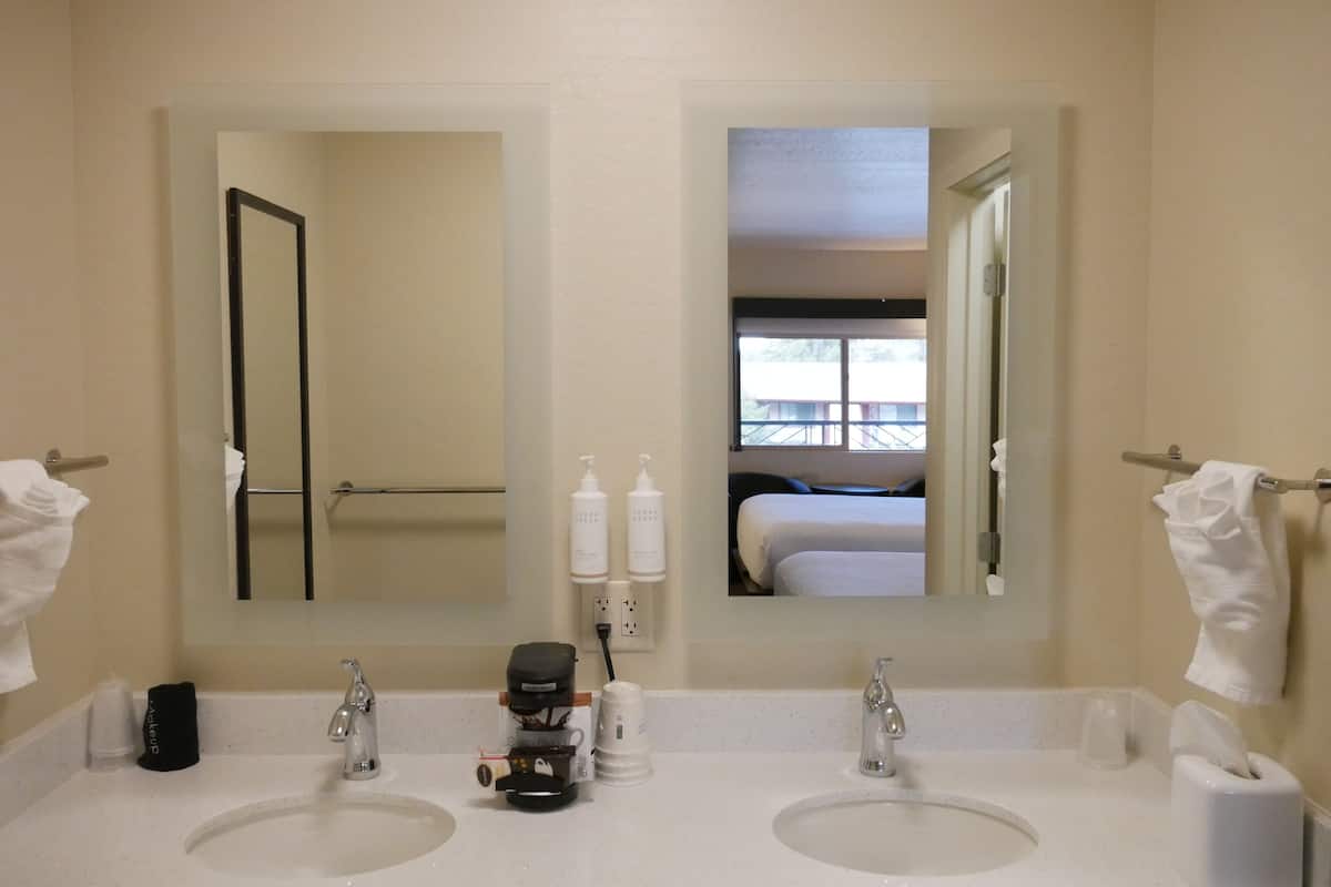 superior room, 2 queen beds, non smoking | bathroom | combined shower/bathtub, eco-friendly toiletries, hair dryer, towels