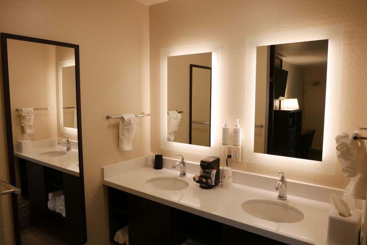 deluxe room, 2 queen beds, non smoking | bathroom | combined shower/bathtub, eco-friendly toiletries, hair dryer, towels