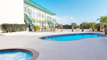 Outdoor pool, open 8 AM to 10 PM, pool umbrellas, pool loungers