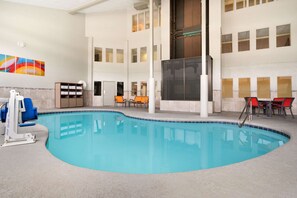 Indoor pool, a heated pool, open 9:00 AM to 10:00 PM, pool loungers