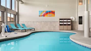 Indoor pool, a heated pool, open 9:00 AM to 10:00 PM, pool loungers