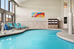 Indoor pool, a heated pool, open 9:00 AM to 10:00 PM, pool loungers