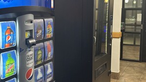 A vending machine with various drink options including Pepsi, Crush, and Aquafina. - Red Roof Inn & Suites Middleborough (Middleborough)