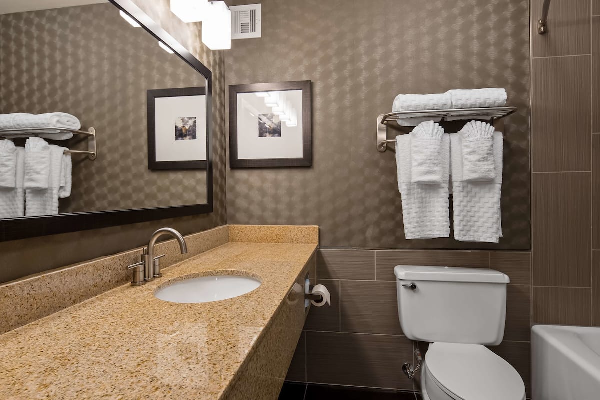 premium bedding, pillow-top beds, desk, laptop workspace