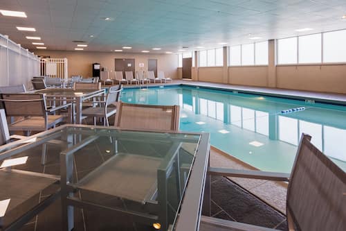 Indoor pool, open 7:00 AM to 11:00 PM, pool loungers