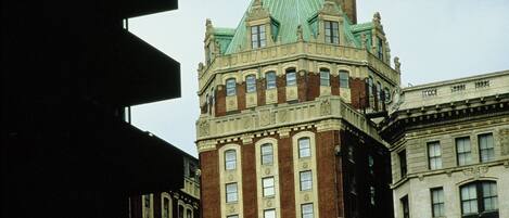 A historic building with a green roof and brick facade.