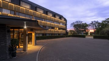 Welcome to our hotel, featuring a contemporary design with a warm and inviting entrance.
