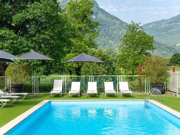 Seasonal outdoor pool, pool loungers