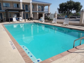 Outdoor pool, open 9:00 AM to 11:00 PM, pool loungers