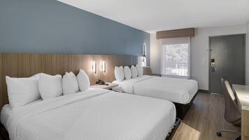 Camas con pillow-top, escritorio y espacio para trabajar con laptop