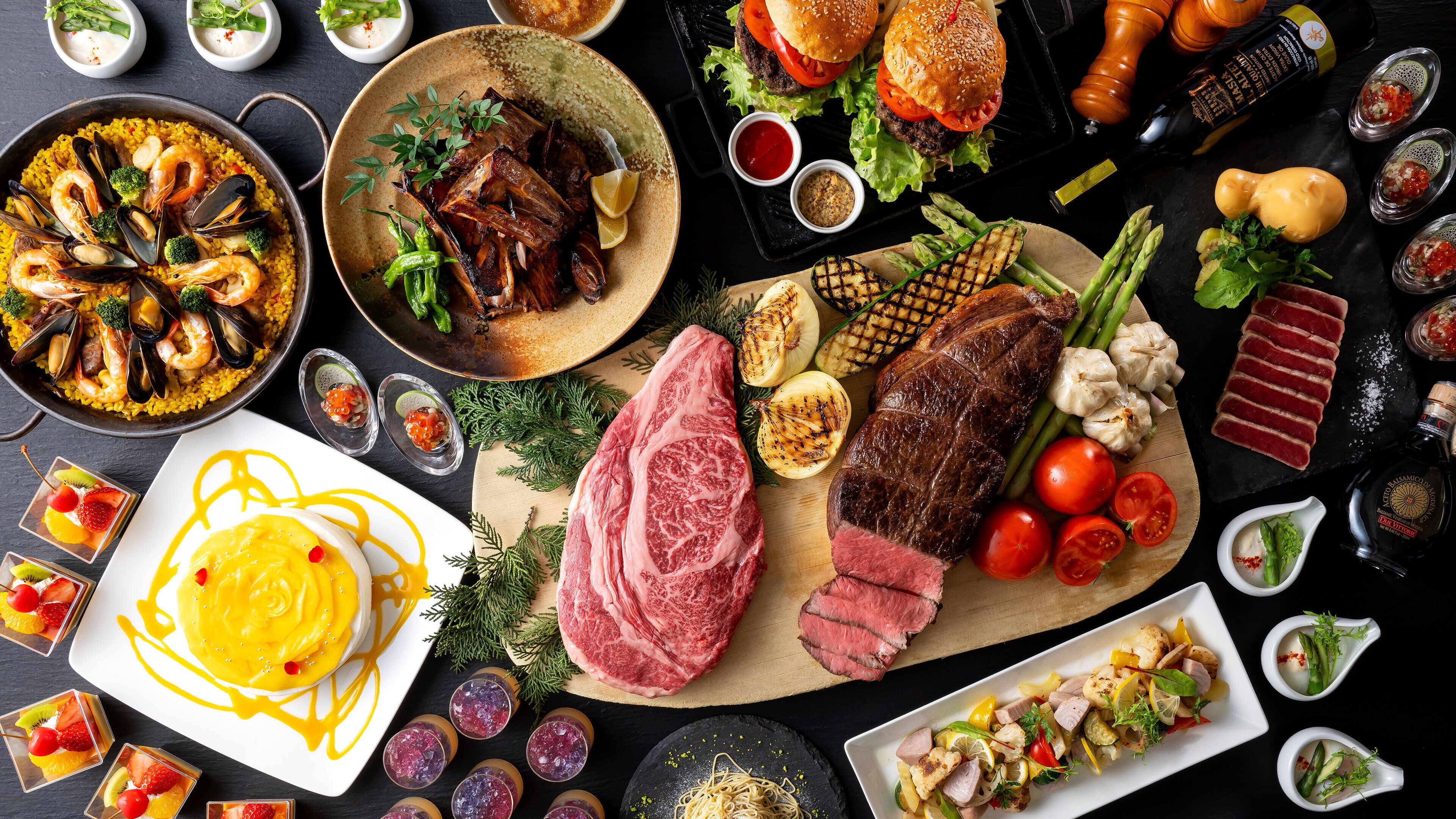 A variety of dishes including seafood, steak, and vegetables, suggesting a diverse culinary selection.